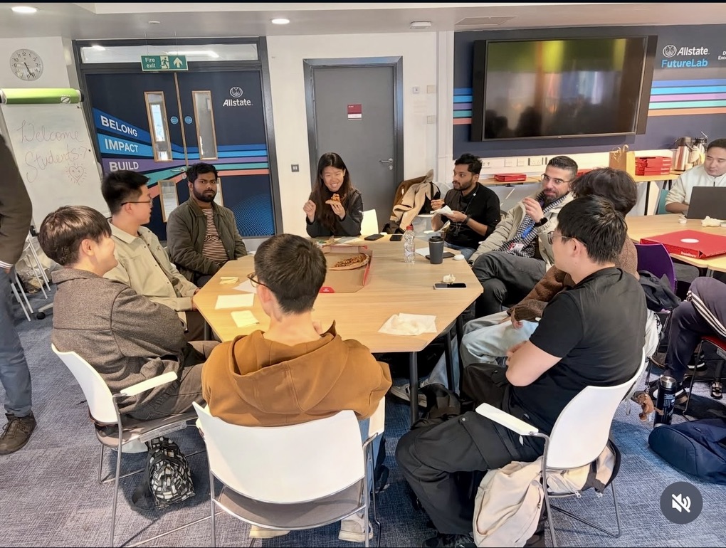 International students sharing pizza during the EEECS Quiz and Pizza Night